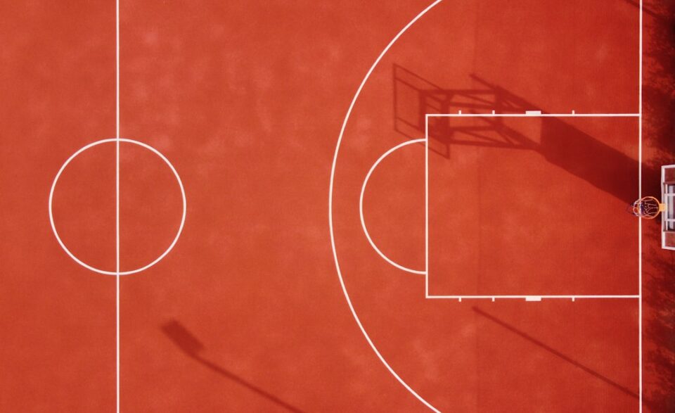basketball tournament strategy cover with clipboard, bracket board, stopwatch, and sideline notes