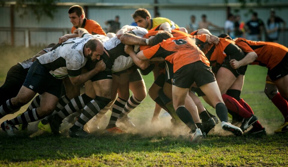 Rugby warm-up routine cover showing players preparing on the pitch