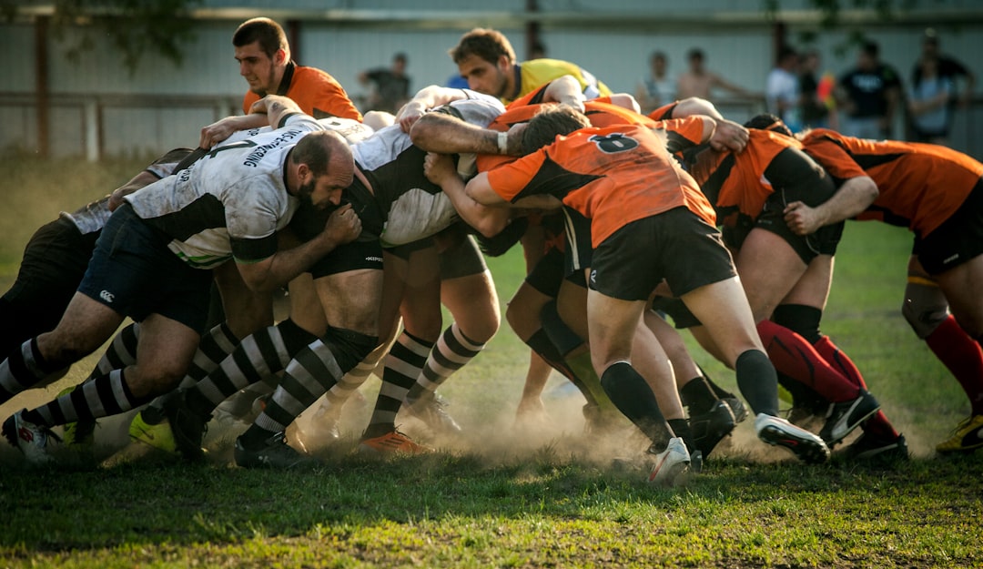 Rugby warm-up routine cover showing players preparing on the pitch